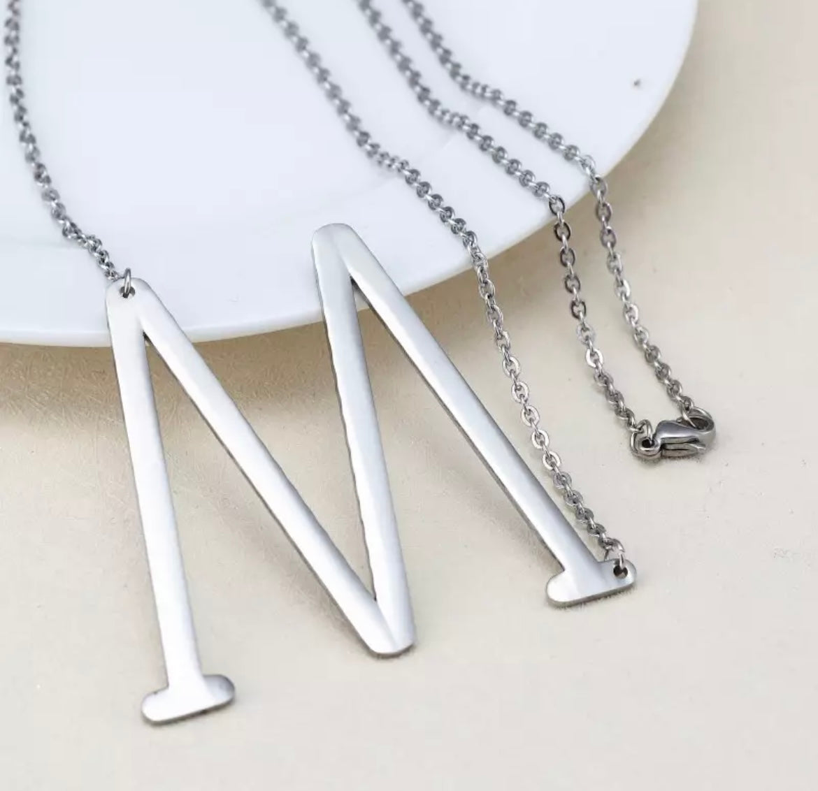 Initial necklaces